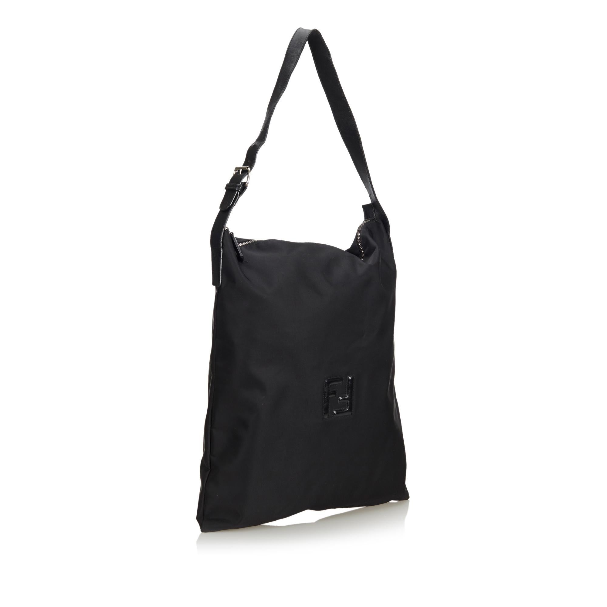 This tote bag features a nylon body, flat leather strap, top zip closure, and interior zip pocket. It carries as B condition rating.

Inclusions: 
This item does not come with inclusions.

Dimensions:
Length: 45.00 cm
Width: 40.00 cm
Depth: 4.00