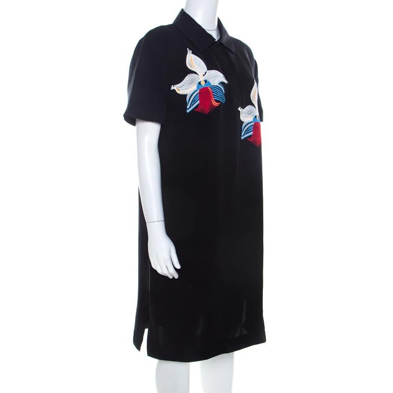This Fendi shirt dress is simply amazing. It has been made from silk and it flaunts a black shade along with colored orchid embroidery at the front, button fastenings and short sleeves. You can team it with sneakers or block heels.

Includes: The