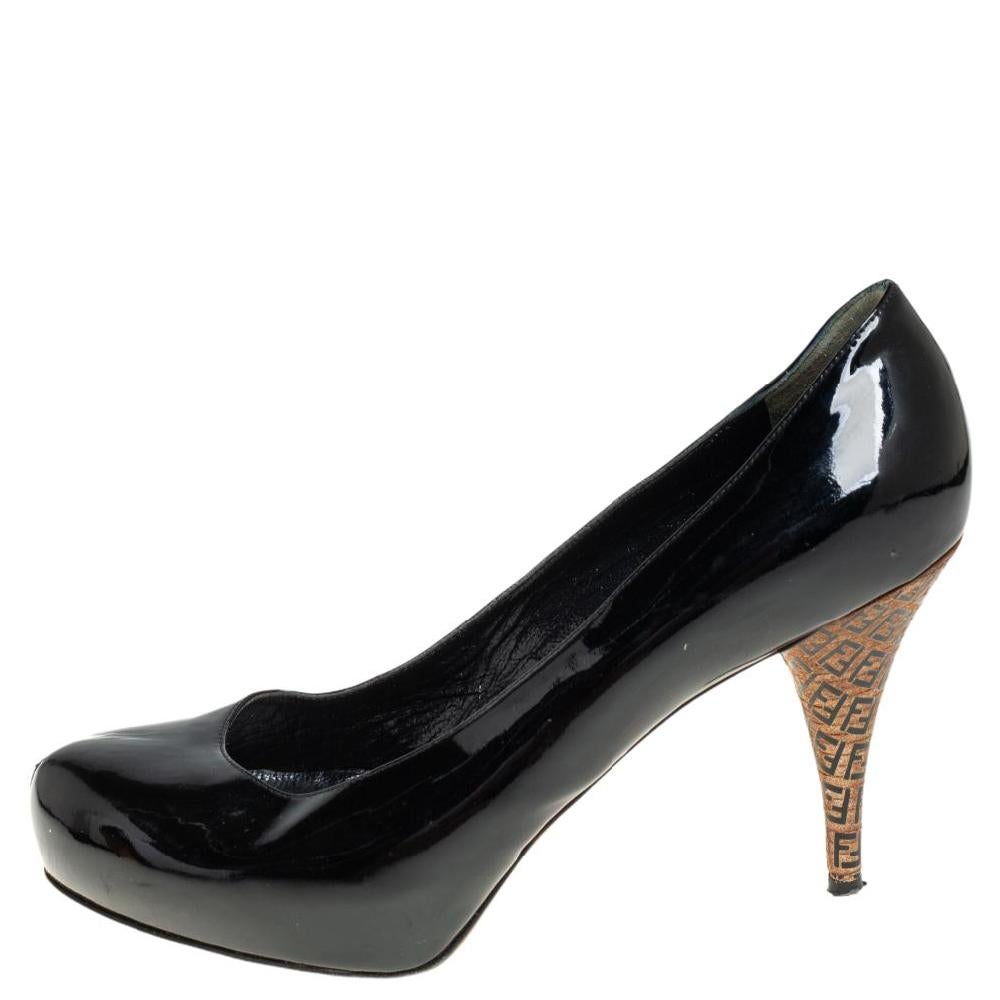 Carefully sewn using patent leather, these designer pumps are sure to look great on your feet. The classic pair by Fendi arrives in a shade of black, with concealed platforms and logo-covered heels.

