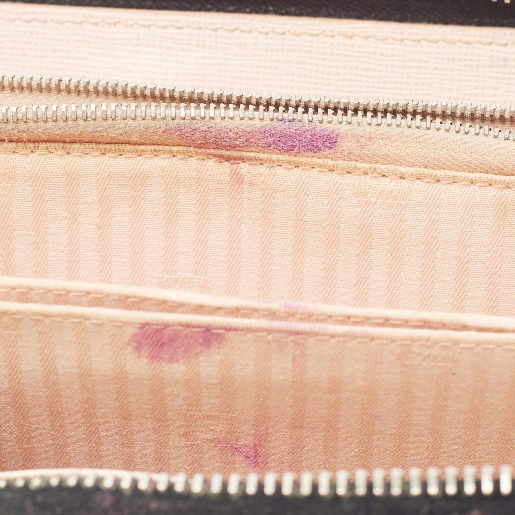Created from patent leather  this Fendi wallet is worth every penny. The brand detailing on the front makes it instantly recognizable  and the zip around closure secures its perfectly sized interior