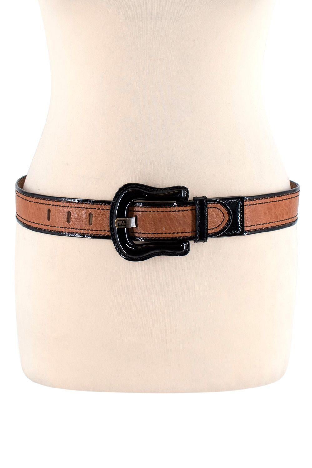 Fendi Black Patent & Tan Leather Belt 80

- Large patent buckle fastening
- Contrasting black top stitching
- Pebble dash leather

Materials:
Leather
Patent

Made in Italy

9/10 Very good condition with minor signs of wear, small black marks on the