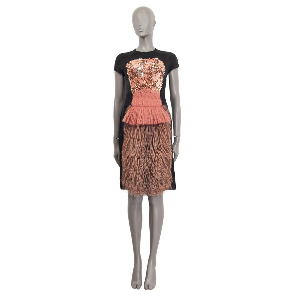 100% authentic Fendi sheath dress in black viscose (53%) and silk (47%). Embellished with an attached dress out of fox fur, mohair, pearls and sequins on the front of the dress. Opens with a concealed zipper and a hook on the back. Lined in black