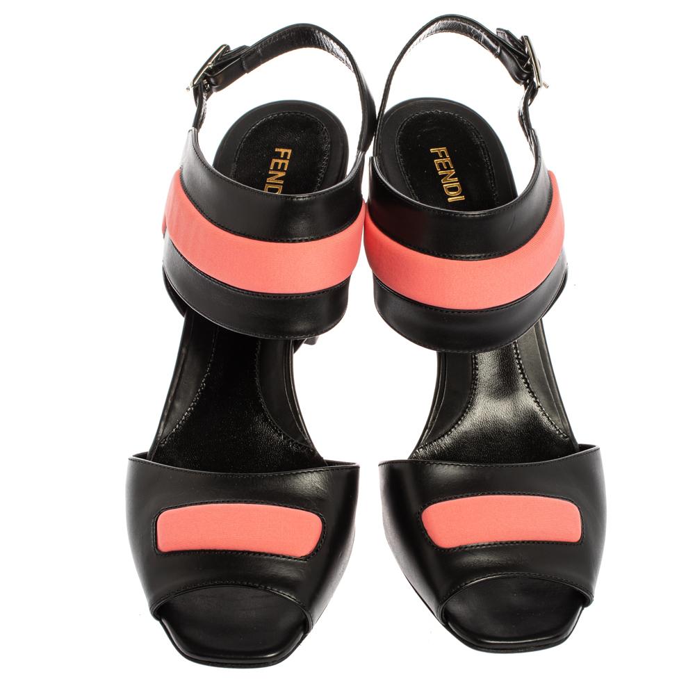 Ditch those boring pairs of stilettos and opt for these fashion-forward sandals from the house of Fendi. Complete any on-trend look with this quirky pair that features a black and pink leather body. The thick, studded heel is marked as the highlight