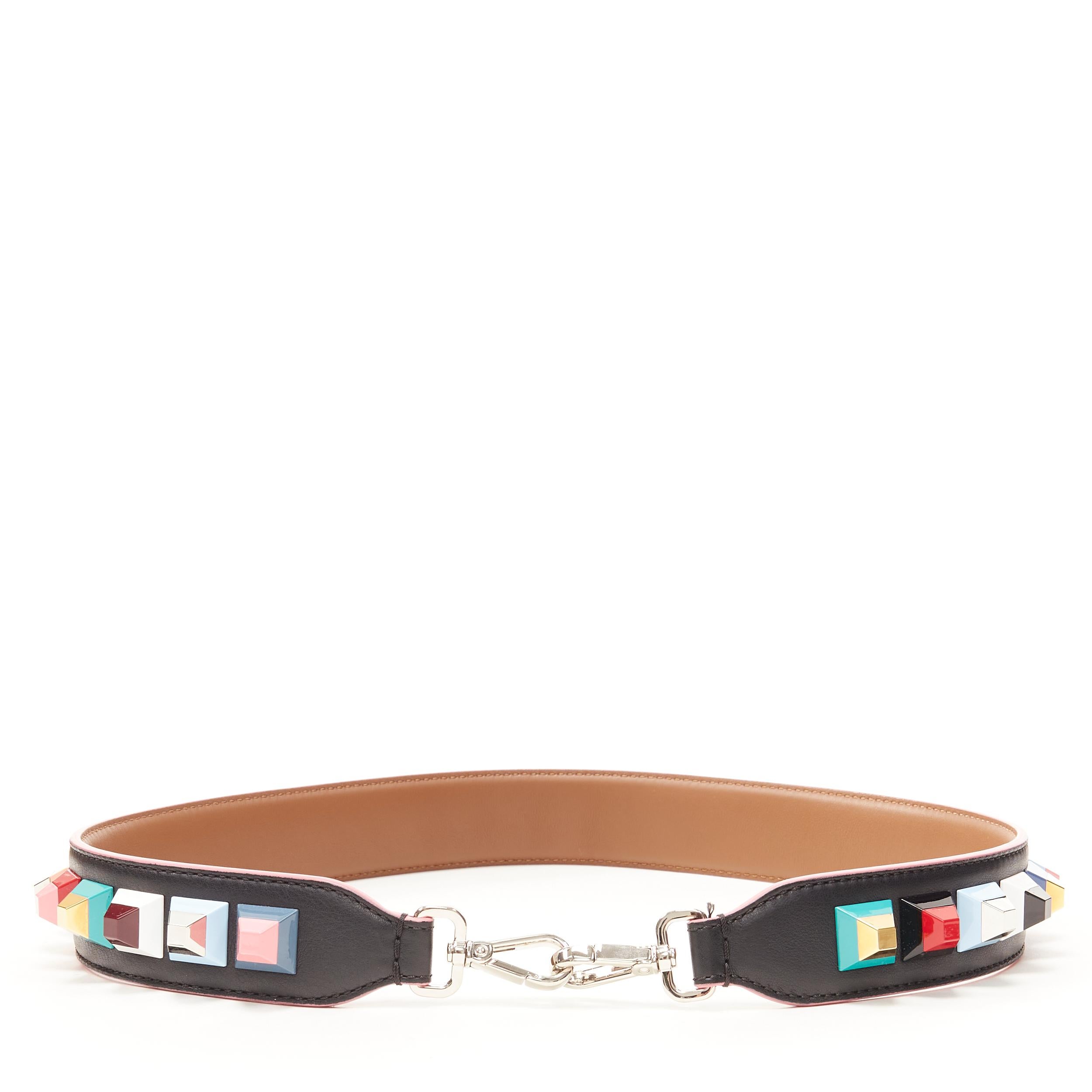 FENDI black pink multicolor resin pyramid stud embellished thick bag strap 
Reference: LNKO/A01768
Brand: Fendi
Material: Leather
Color: Black
Closure: Clasp
Extra Detail: Black leather with pink trimming on edges. Multicolor resin pyramid stud
