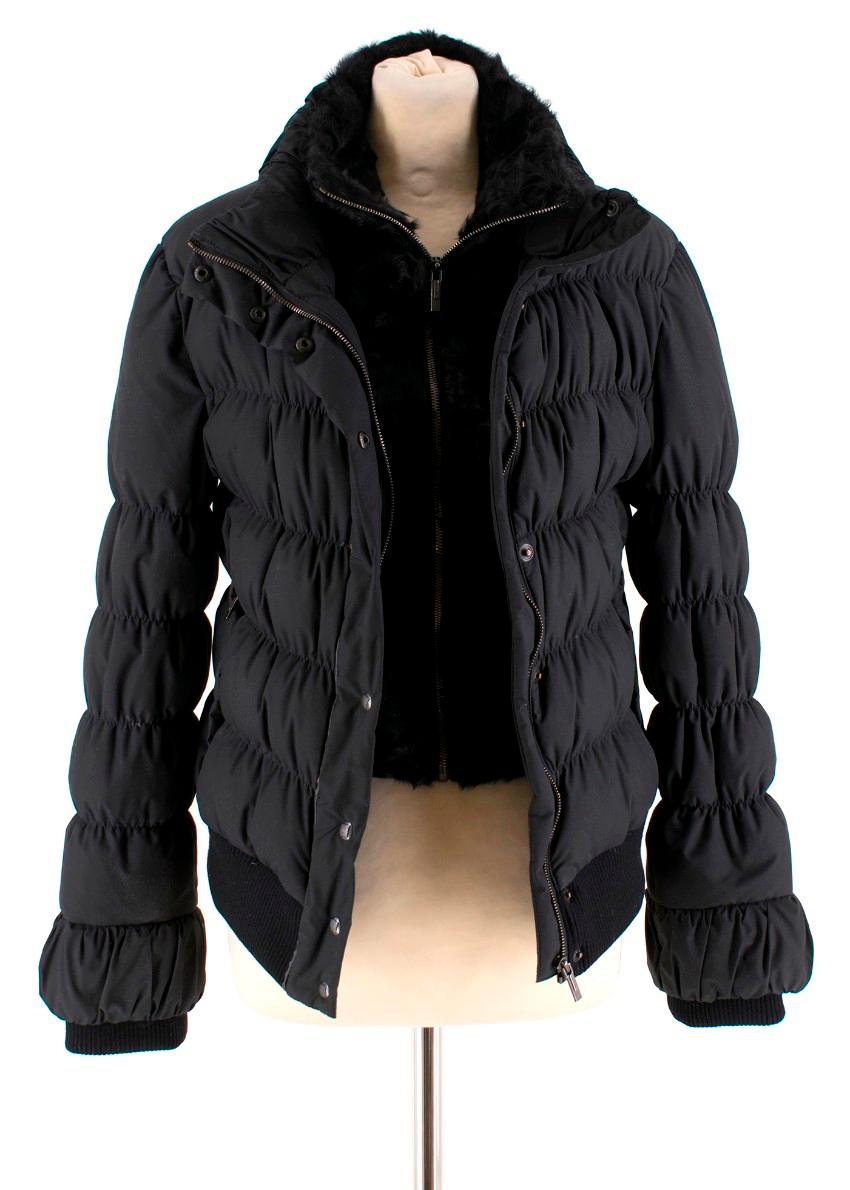 Fendi black puffer jacket with detachable fur to the front featuring a front zip fastening, an elasticated waistband and side slit pockets. RRP £1900

Composition:
- 100% polyester
- Fur: goat fur

- Only Specialist Laundries
- Made in Italy

Please