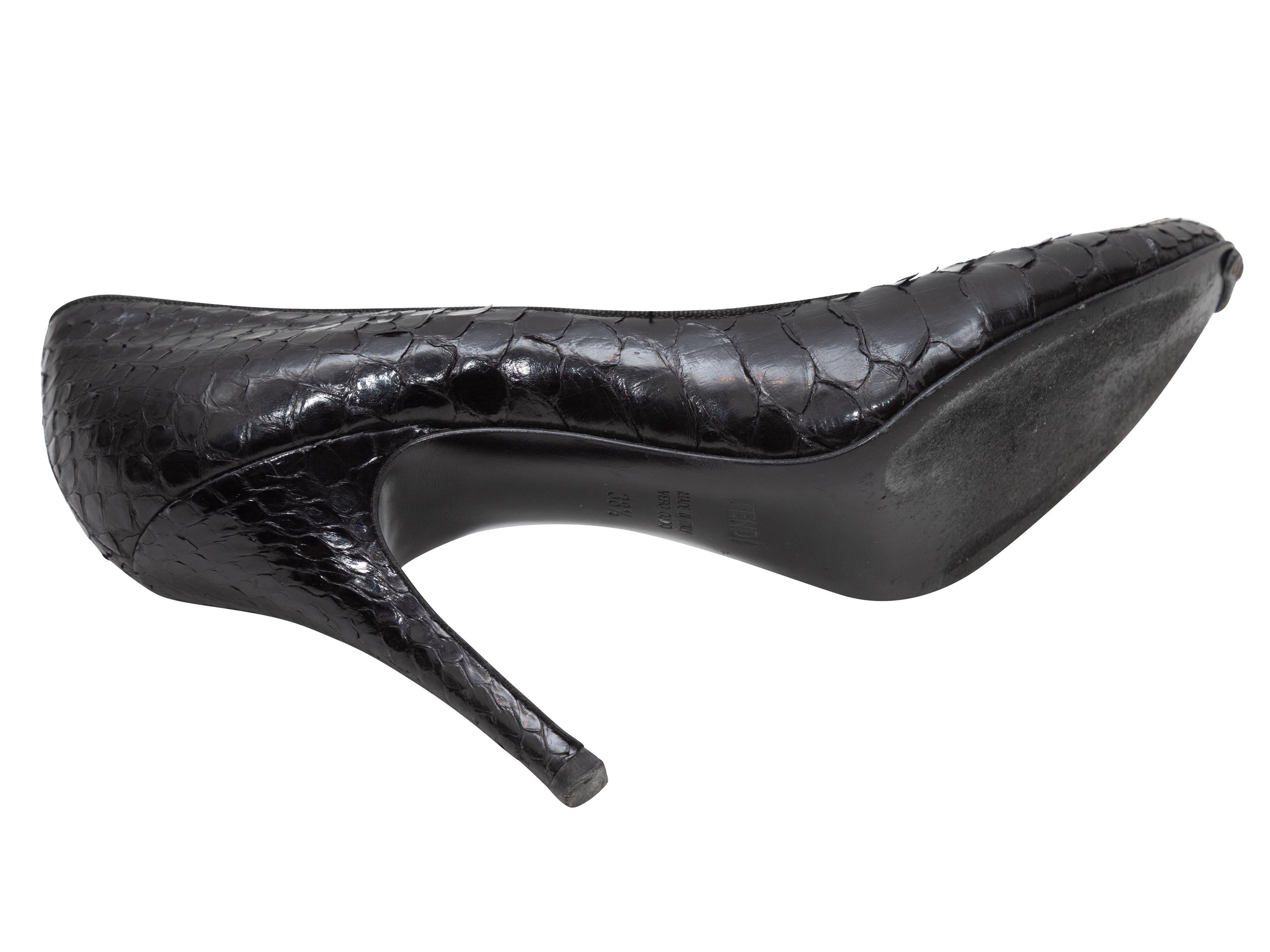 Product Details: Black python almond-toe pumps by Fendi. Grosgrain trim throughout. 4