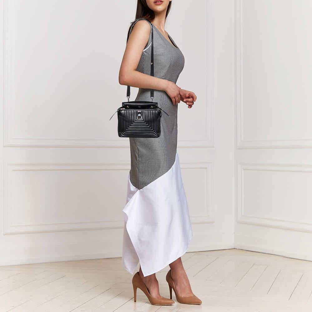 Fendi's Dotcom has a practical design and a luxe charm. Crafted using leather, the bag has a quilted black exterior, and the top zippers reveal lined compartments sized perfectly to carry your essentials. The bag is complete with a top handle and a