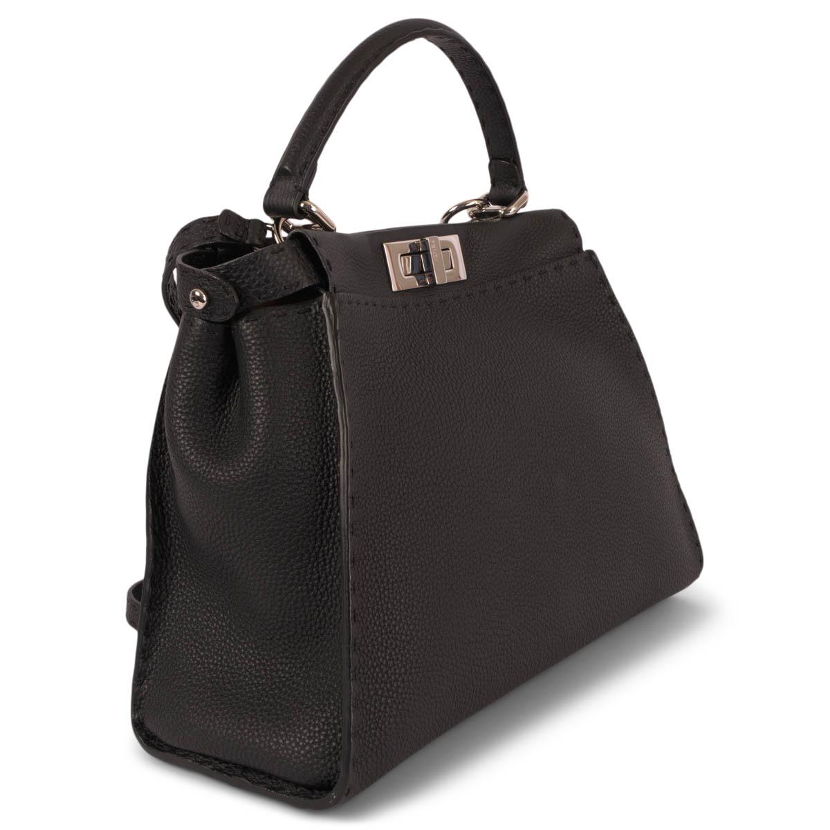 100% authentic Fendi Peekaboo ISeeU Medium Selleria bag in black Cuoio Romano leather. Features hand stitched details, classic twist lock on both sides and an adjustable and detachable shoulder strap. Inside is divided into two compartments and is