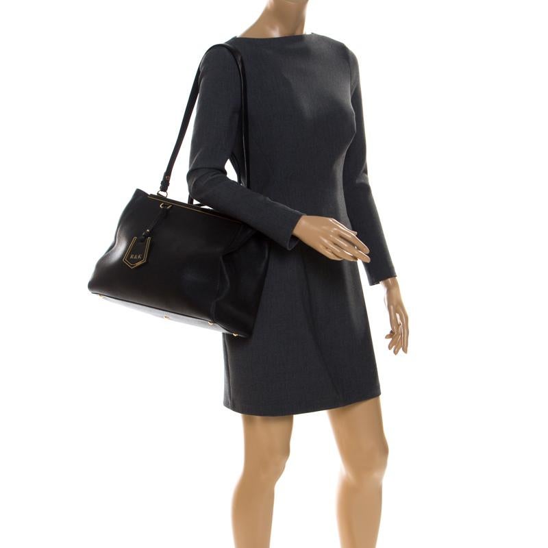 Fendi's 2Jours tote is one of the most iconic designs from the label and it still continues to receive the love of women around the world. Crafted from black leather, the bag features double rolled handles. It is also equipped with a fabric interior
