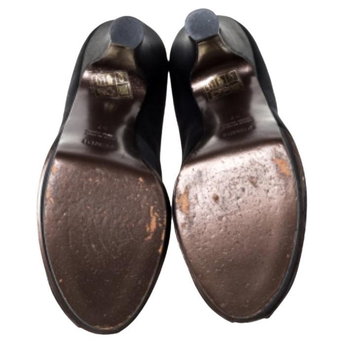 Crafted beautifully, these ankle booties from Fendi bring the right collision of comfort and fashion. Designed with peep toes and lace-ups, the black satin booties feature platforms and 11 cm heels.