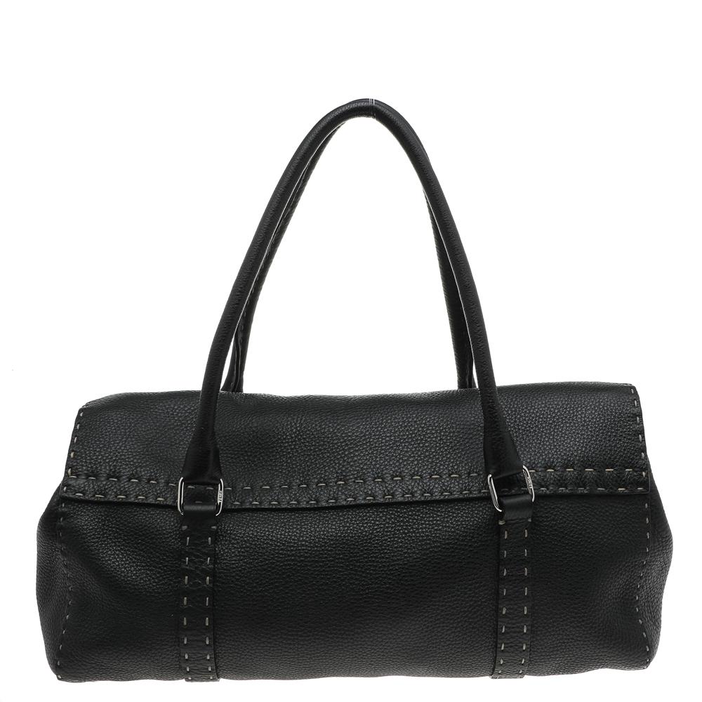 Perfect to carry at work, this 'Linda' satchel from Fendi is a must-have! Crafted in genuine leather, the bag features dual handles, silver-tone hardware, and protective metal feet. The black piece opens into a fabric-lined interior that can easily