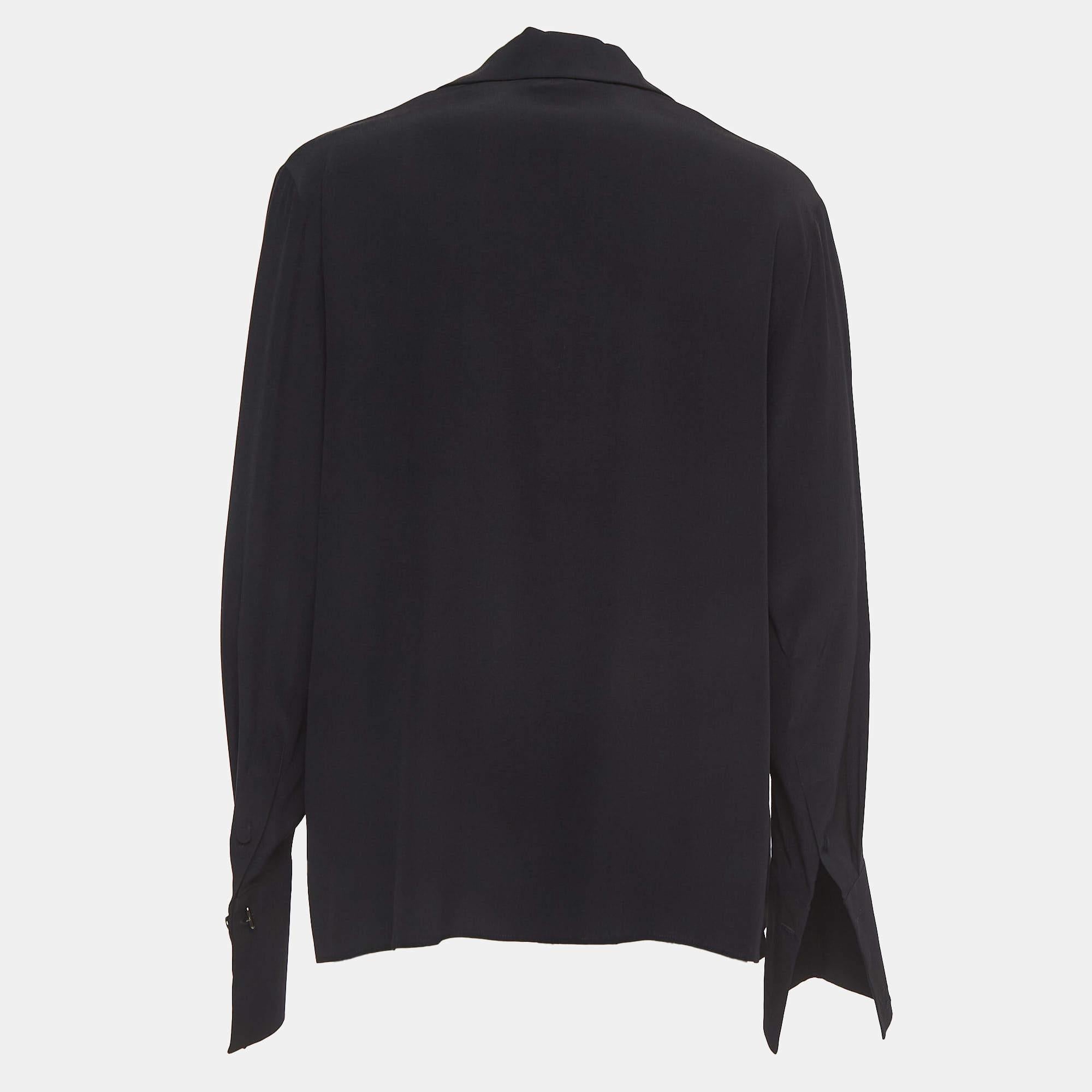Exhibiting an elegant design, this Fendi top is a closet staple. A blacktop like this can be paired with different bottoms to finish your look elegantly. Pair this silk top with high-waisted bottoms and gold accessories for a chic look.