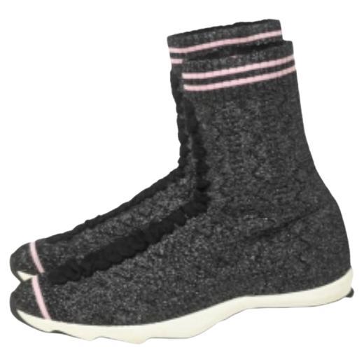 Designed in a sock-like silhouette, these high-top sneakers from Fendi are crafted from knit fabric and have an easy slip-on style. They feature lace-up detailing, stripes, and durable rubber soles.