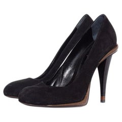 Fendi, black suede and bronze pump.