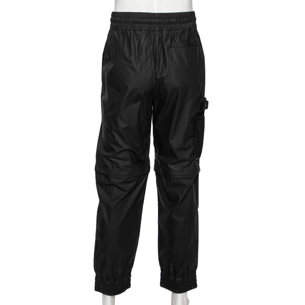 These Cargo trousers from the House of Fendi will make a comoftable addition to your closet. They are tailored using black synthetic fabric and feature a superb fit. They are adorned with a tie detail on the waistline. Sport a comfy look with these