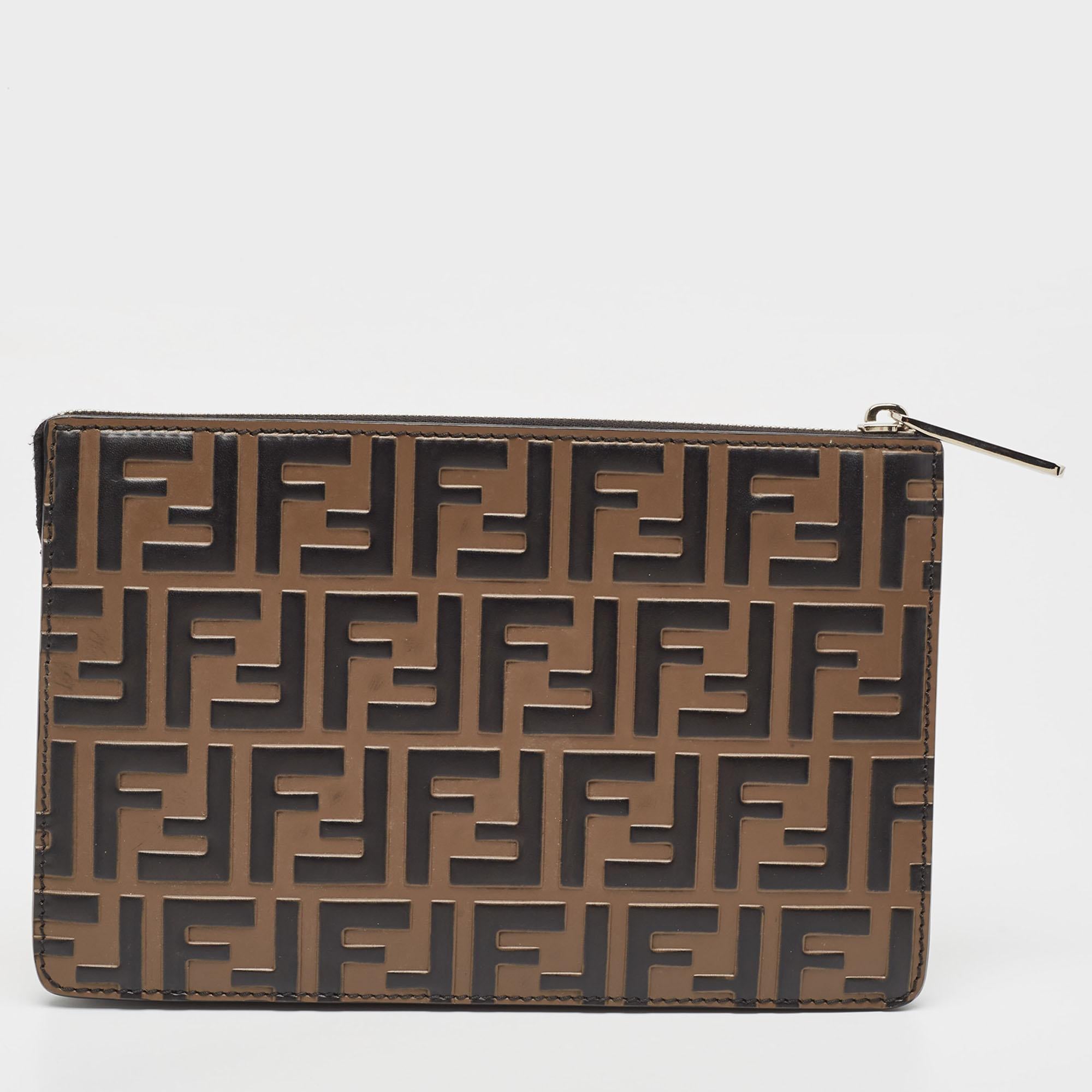 This Fendi pouch shows the brand's expertise in creating durable and significant pieces. Created from quality materials, it is equipped with a perfectly-sized interior, and it embodies a chic display.

Includes: Info Booklet