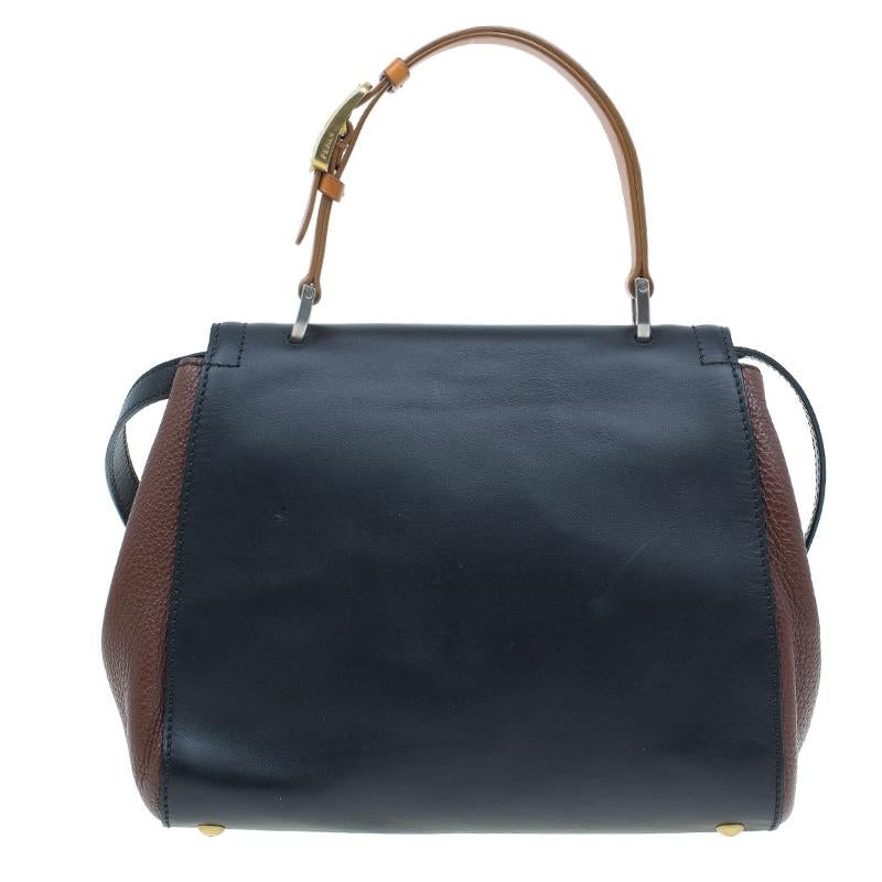 Named after the late Italian actress Silvana Mangano, this Fendi Silvana satchel perfectly blends black leather with brown leather sides. Equipped with an adjustable leather strap and top handle, its flap closure opens up to a canvas lined interior