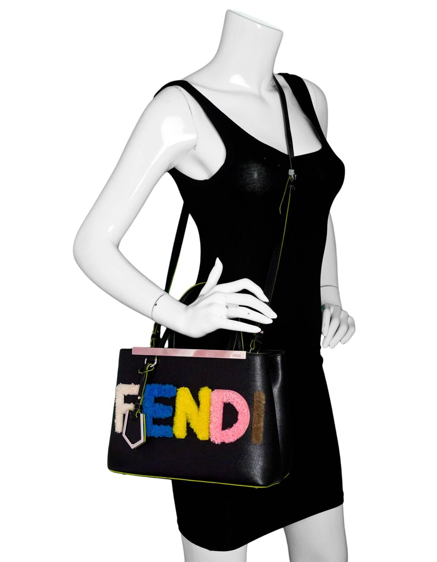 Fendi Black Vitello Elite Shearling Logo Petite 2 Jours Tote
Features shearling multi-colored logo on front. Features optional shoulder/crossbody strap

Made In: Italy
Color: Black and multi-colored
Hardware: Silvertone
Materials: Leather and