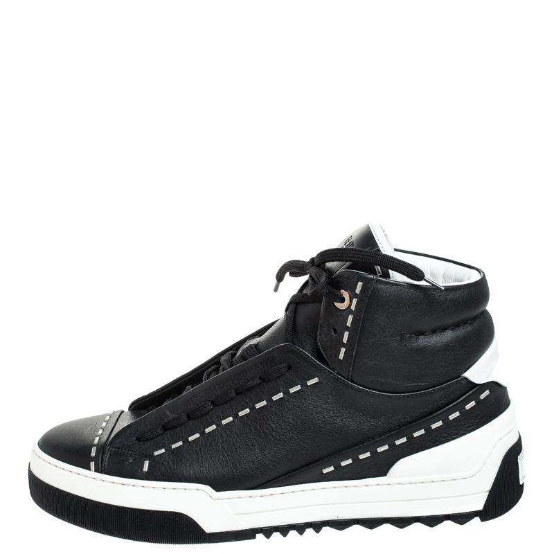 Complete your smart, casual look by wearing these trendy sneakers, crafted from leather. They are designed in a high-top silhouette with rubber soles and lace-ups. This sneakers from the house of Fendi is accented with contrasting stitch details on