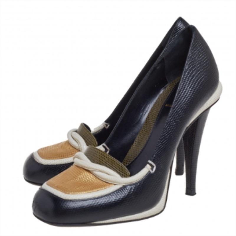 Crafted from lizard-embossed leather, these pumps from Fendi simply stand out! They feature a square-toe silhouette with entwined strap details on the vamps and stand tall on 10 cm heels. They are complete with comfortable leather-lined insoles.