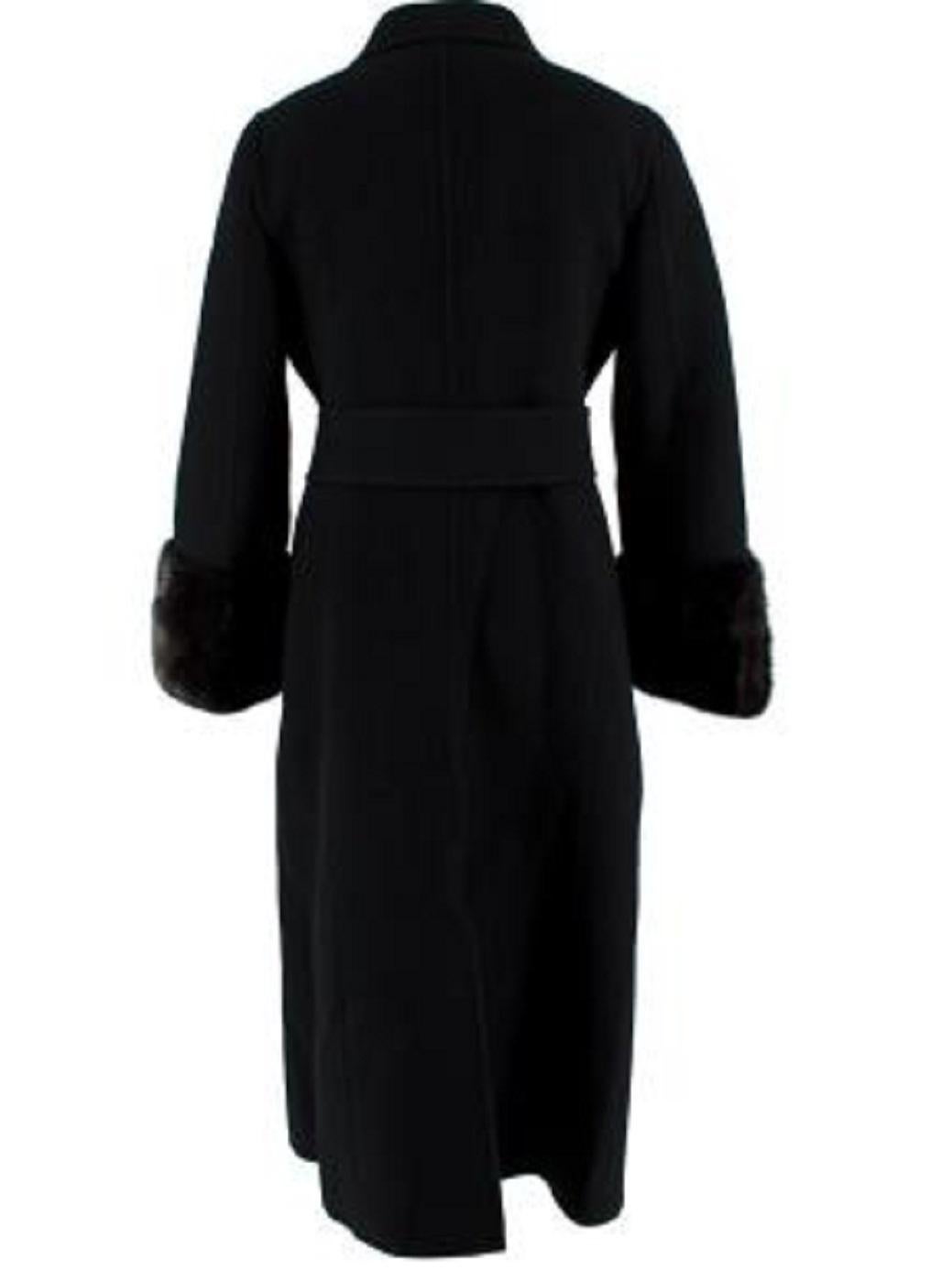 Fendi Black Wool Longline Coat with Mink Fur Cuffs

- Mid weight wool
- Soft mink fur embellished cuffs 
- Slim fitting 
- Mid length 
- Double breasted  button fastening

Materials:
Body: 100% Wool
Cuffs: 100% Mink
Other: 100% Silk 

Made in Italy
