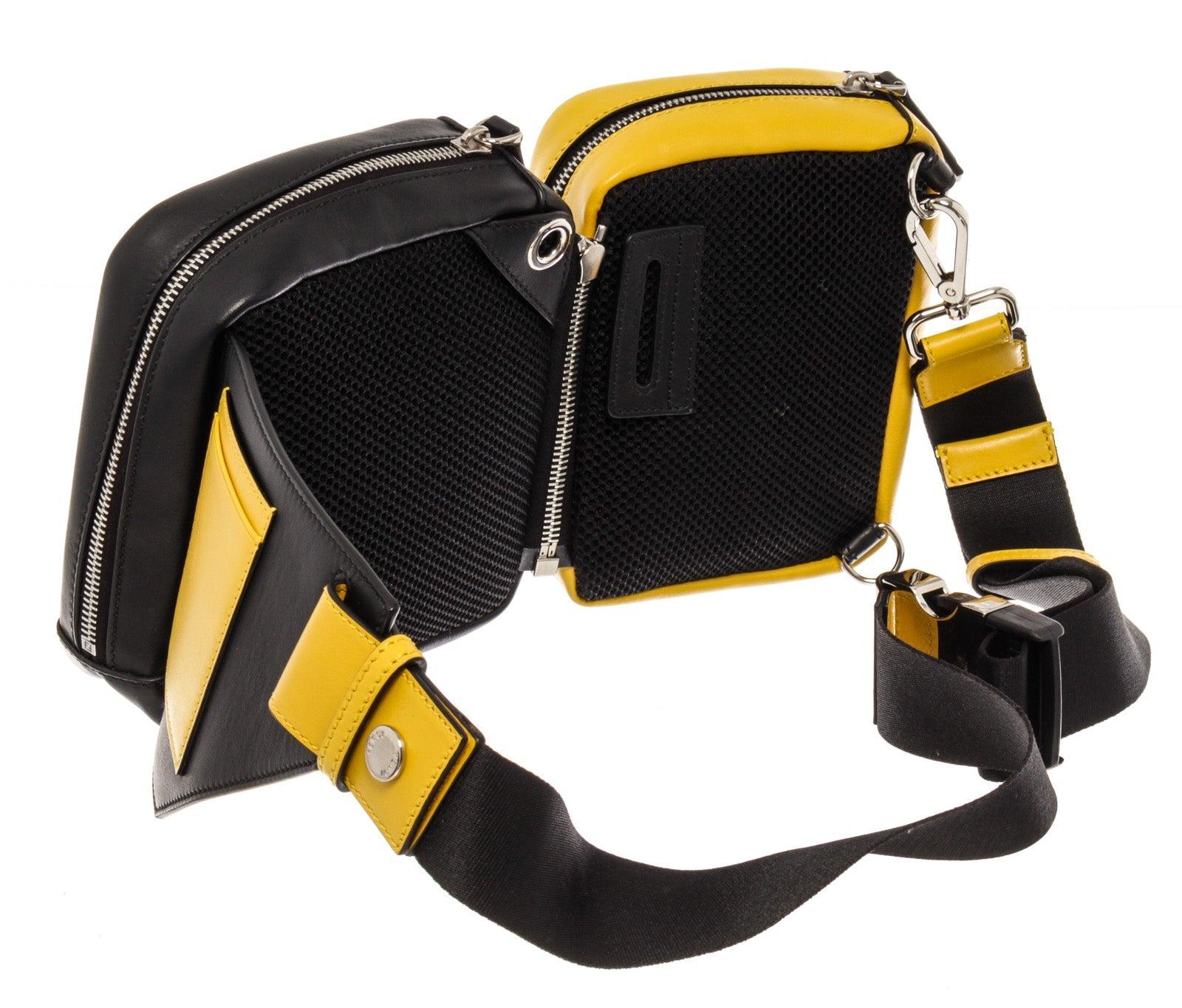 Black Zucca coated canvas with yellow and black Calfskin leather Fendi Multi Pouch Forever waist bag features silver-tone hardware, twin convertible buffed pouches, Calfskin trim in yellow, tonal piping, detachable and adjustable belt-style webbing