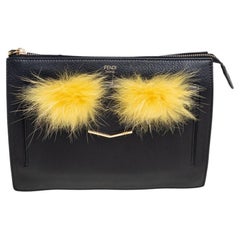 Fendi Monster-Clutch aus schwarzem/gelbem Leder