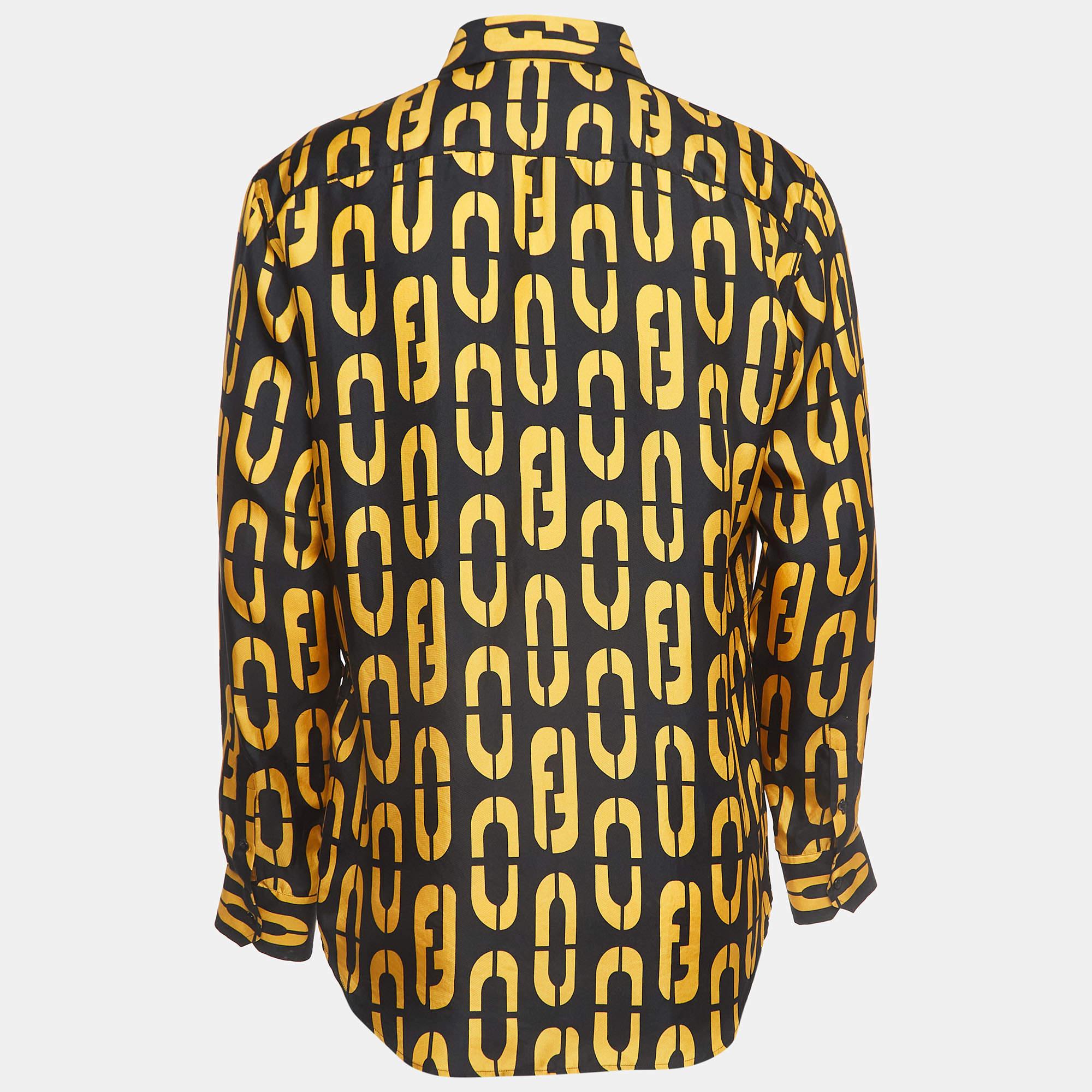 Crafted from luxurious silk, this Fendi shirt boasts a striking black and yellow logo print, exuding sophistication and style. With full sleeves adding an elegant touch, it's a statement piece perfect for making a bold impression with impeccable