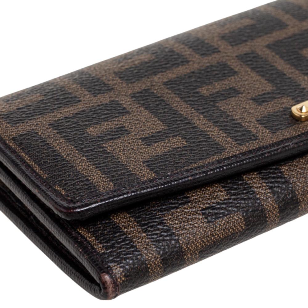 This Fendi wallet is an immaculate balance of sophistication and rational utility. It has been designed using prime quality materials and elevated by a sleek finish. The creation is equipped with ample space for your monetary essentials.

Includes;