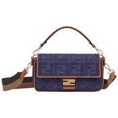 Fendi Blue Denim Embossed Monogram Baguette Bag w. Strap rt. $2, 590