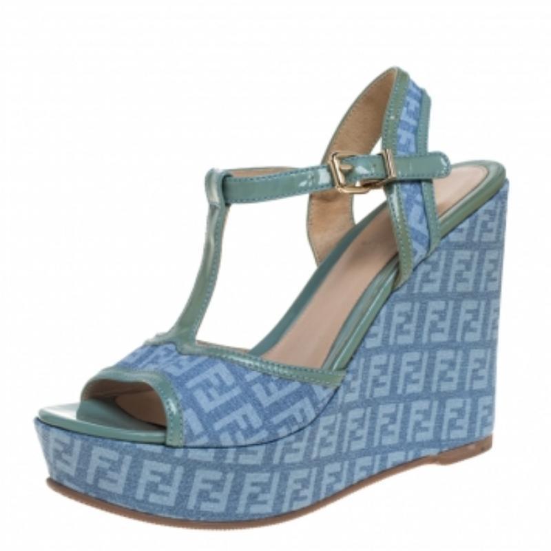 These sandals from Fendi are simply amazing! They have been crafted from canvas and patent leather trims and styled in an open toe silhouette. They flaunt buckled ankle straps and come equipped with comfortable leather-lined insoles and 12 cm