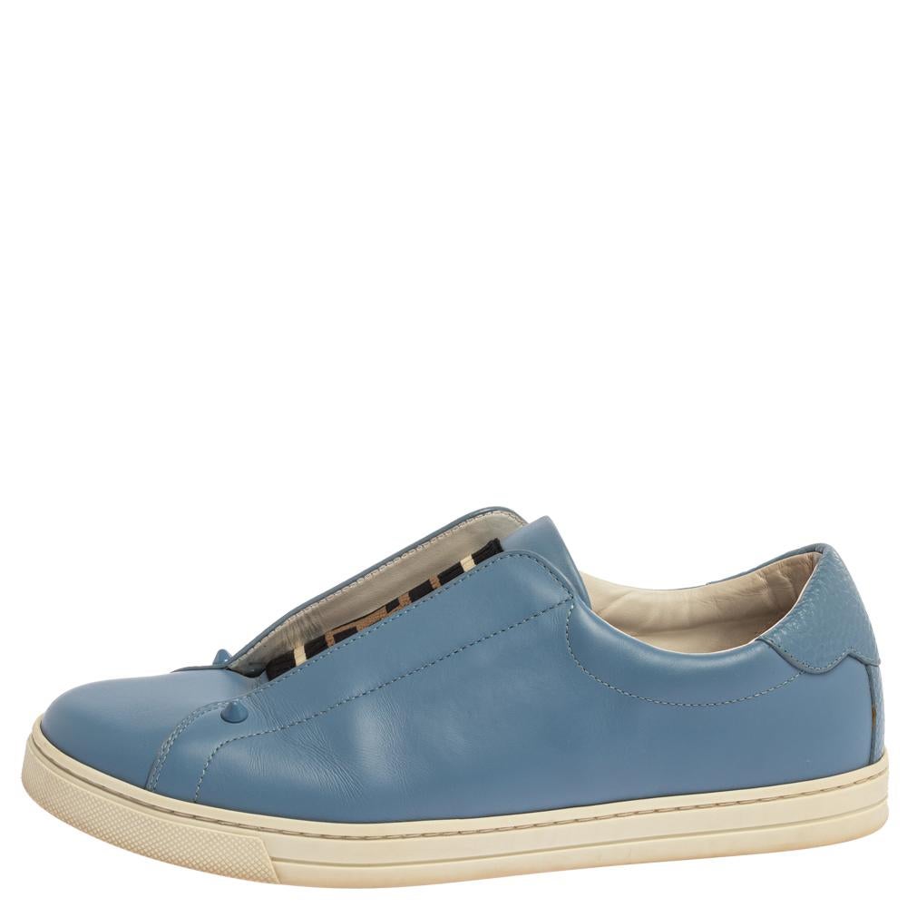 Flaunt your love for fashion when you wear these slip-on sneakers from Fendi. These blue sneakers will lend a chic and sporty look. They have been crafted from leather and styled with round toes and logo detailed cotton knit vamps. They are complete