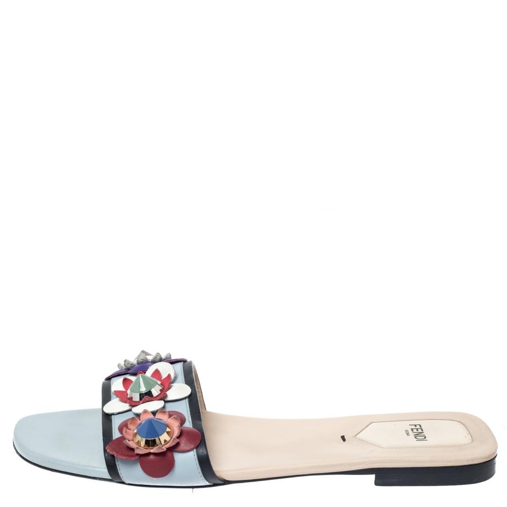 Exquisite and enchanting, these Flowerland slides from Fendi are worth every penny you spend! The blue slides are crafted from leather and feature an open toe silhouette. They've been embellished with colorful flower motifs on the uppers and