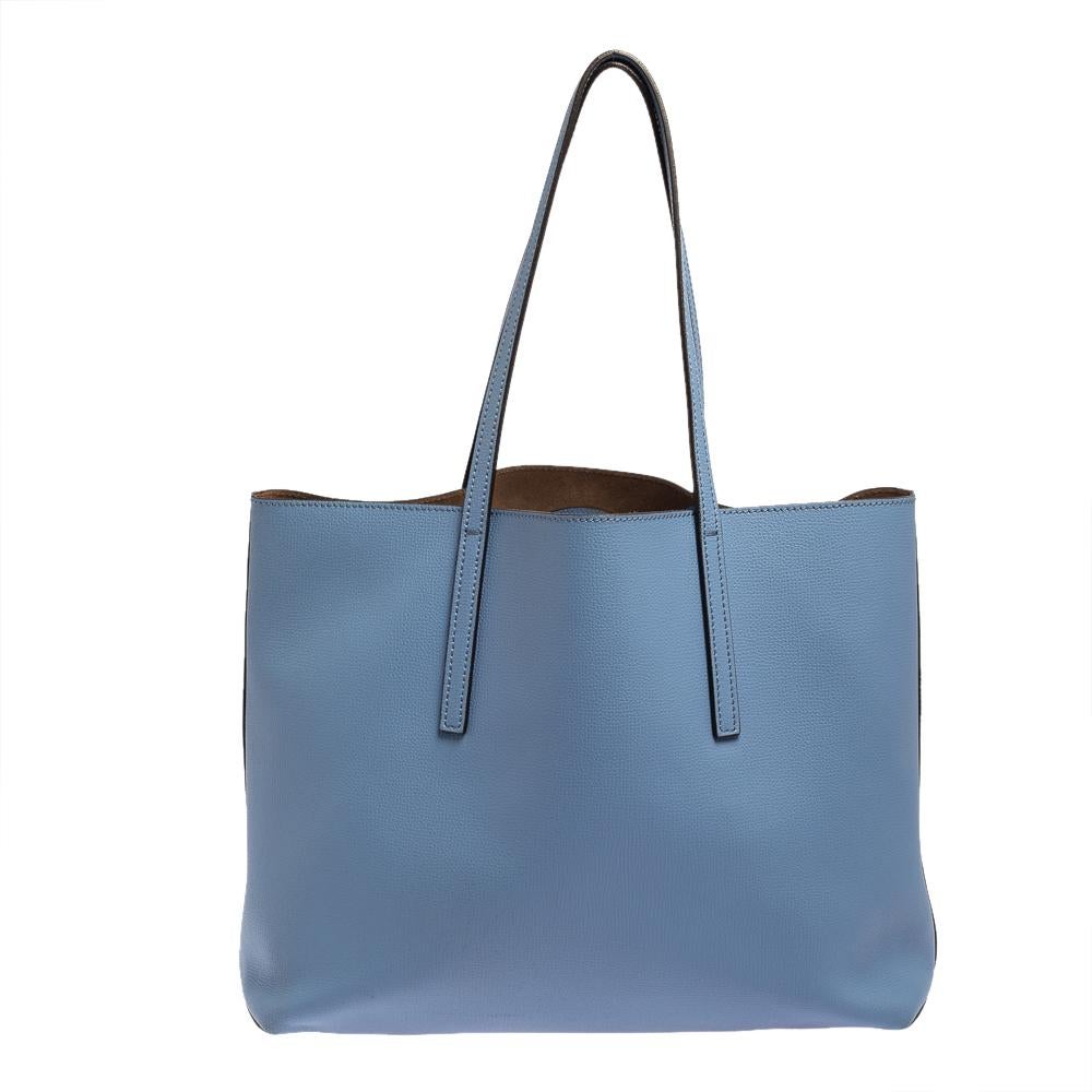 The Kan I is a Fendi gem that joins the brand's list of investment-worthy designer bags. Crafted in blue leather, the shopper tote is highlighted by the iconic F symbol on the front. Its interior is spacious and is held by two handles.

Includes: