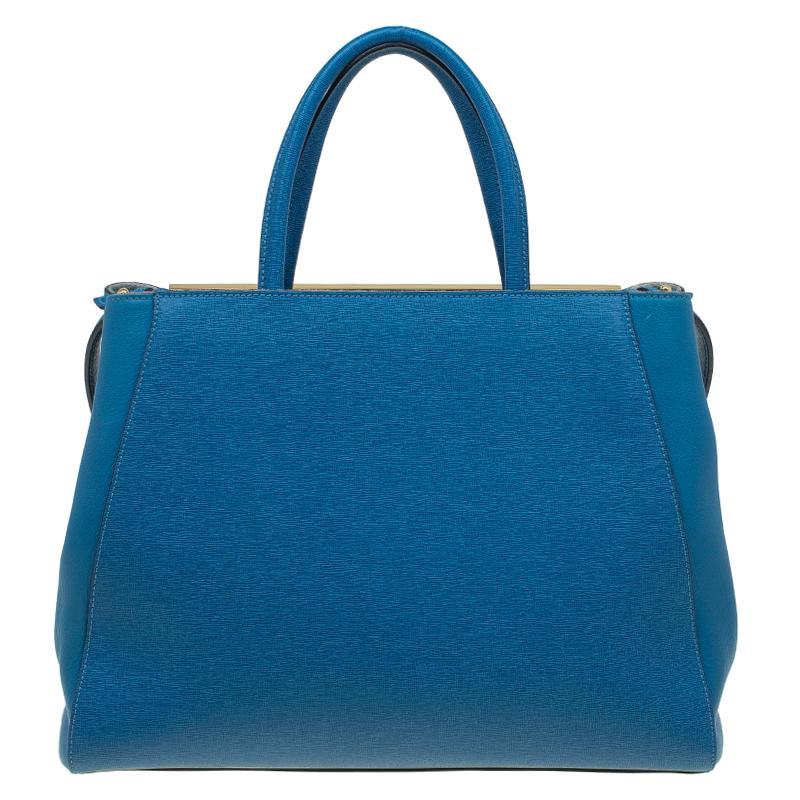 The Fendi for women edit features bold, lavishly created pieces. This handbag pairs playfully striking detailing with traditional and more exuberant shapes. Blue leather 2Jours tote from Fendi features round top handles, an adjustable shoulder