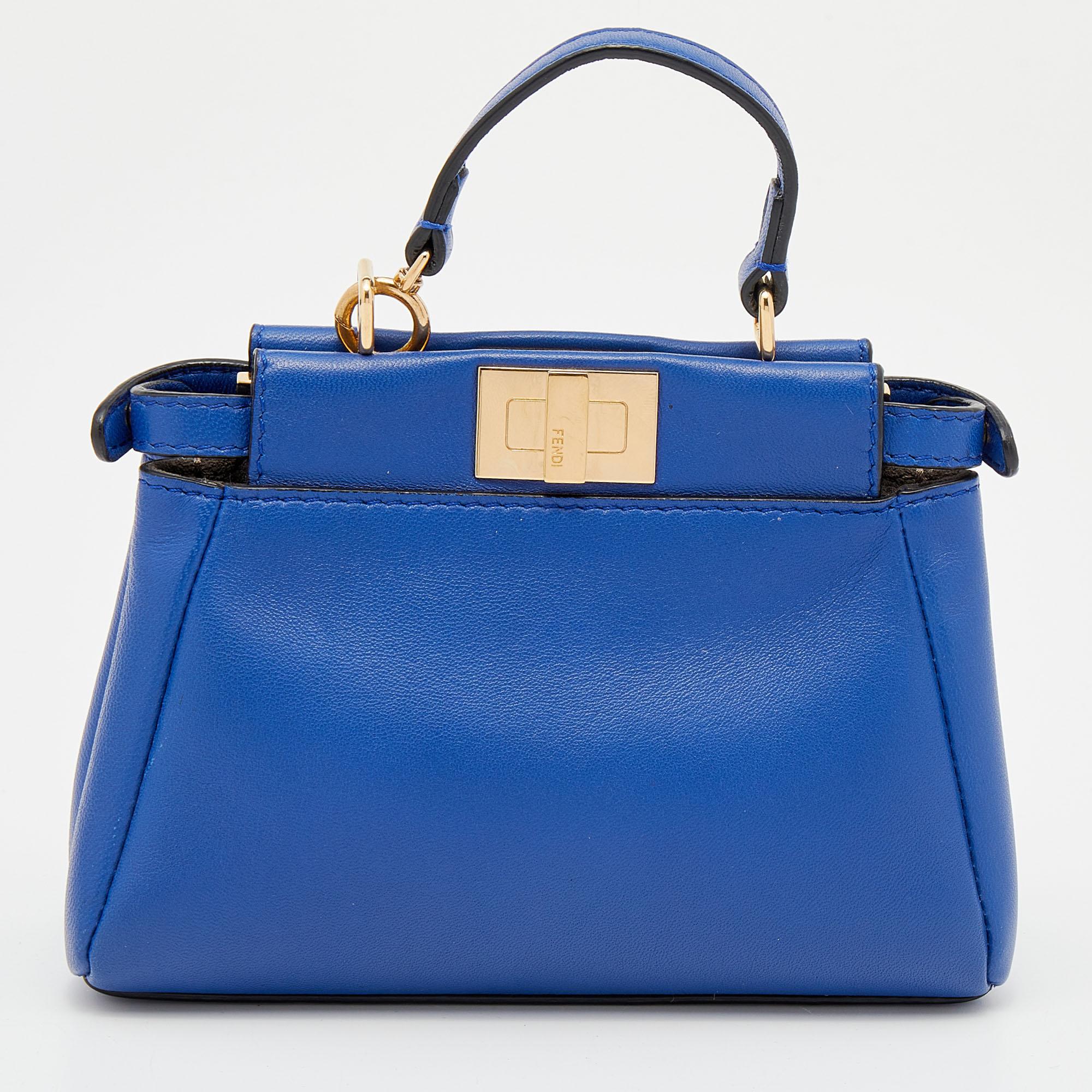 This exquisite Peekaboo from Fendi is highly coveted, and since its birth in 2009, it has swayed us with its shape, design, and beauty. This sized-down micro version comes meticulously crafted from leather and designed with a top handle for you to