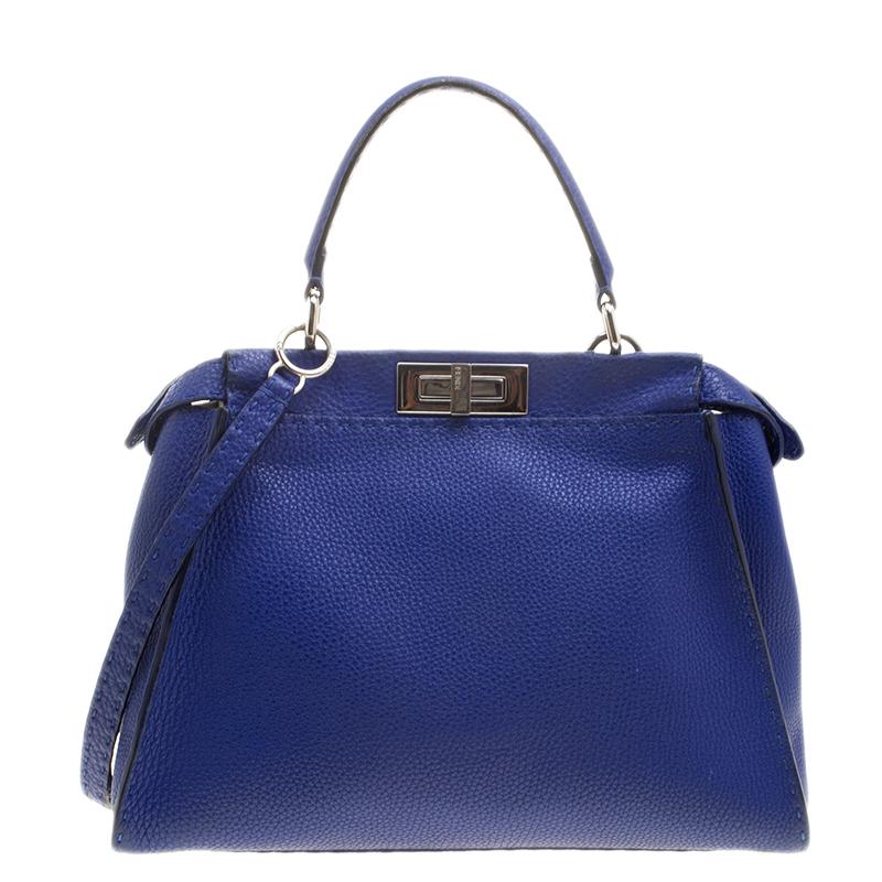 This heavenly Peekaboo from Fendi is highly coveted, and since its birth in 2009, it has swayed us with its shape, design, and beauty. This blue version is a joy to witness! It comes meticulously crafted from leather and designed with a top handle