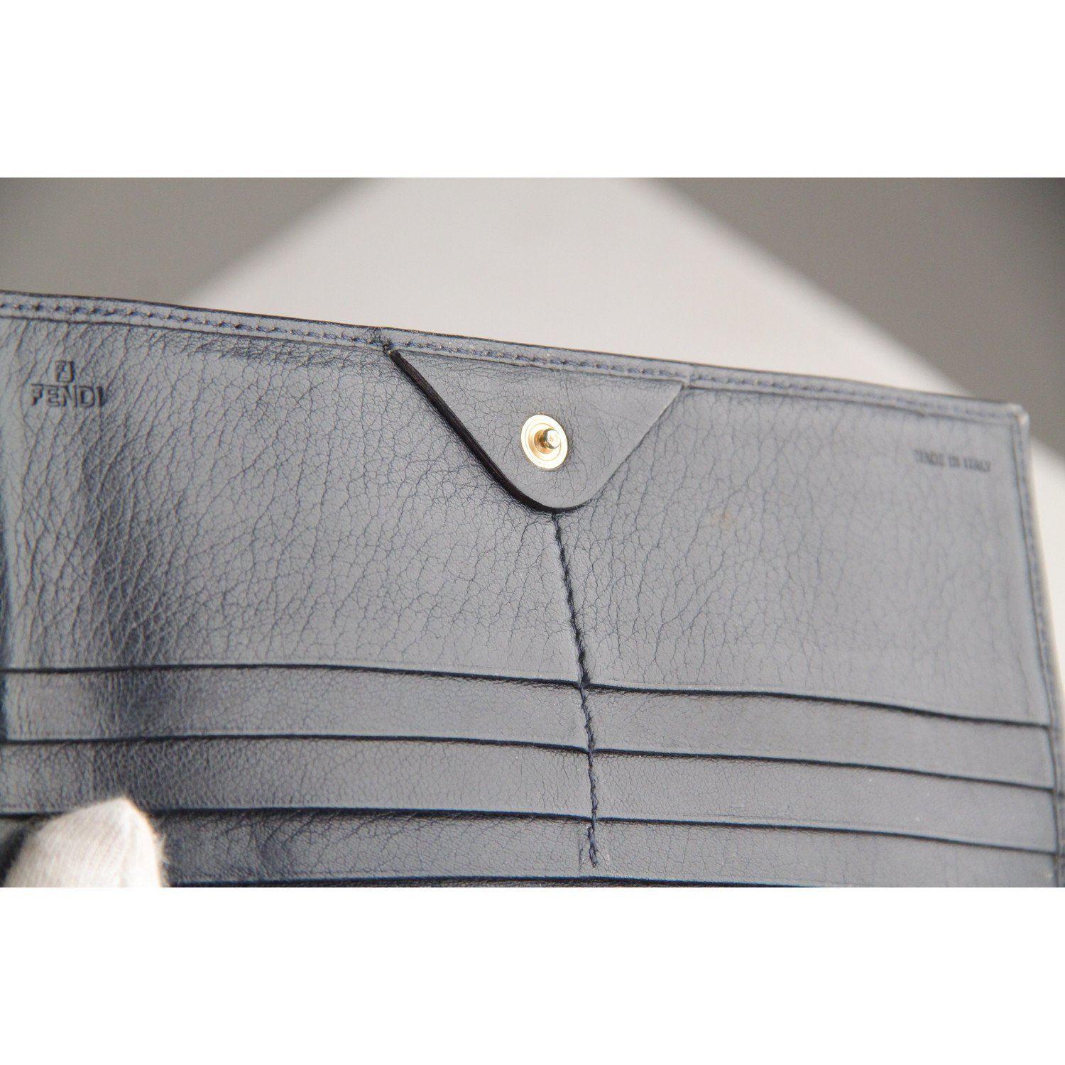 MATERIAL: Canvas COLOR: Black MODEL: Long Wallet GENDER: Women CONDITION RATING: B :GOOD CONDITION - Some light wear of use CONDITION DETAILS: Some normal wear of use on leather trim MEASUREMENTS: HEIGHT: 4 inches - 10,2 cm LENGTH: 7.5 inches - 19