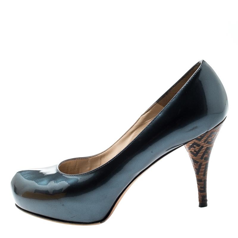 Wear these Fendi pumps with confidence. Made from blue patent leather, they feature sophisticated 9.5 cm heels covered in the brand's logo print for a signature finish. These pumps are complete with concealed platforms and leather