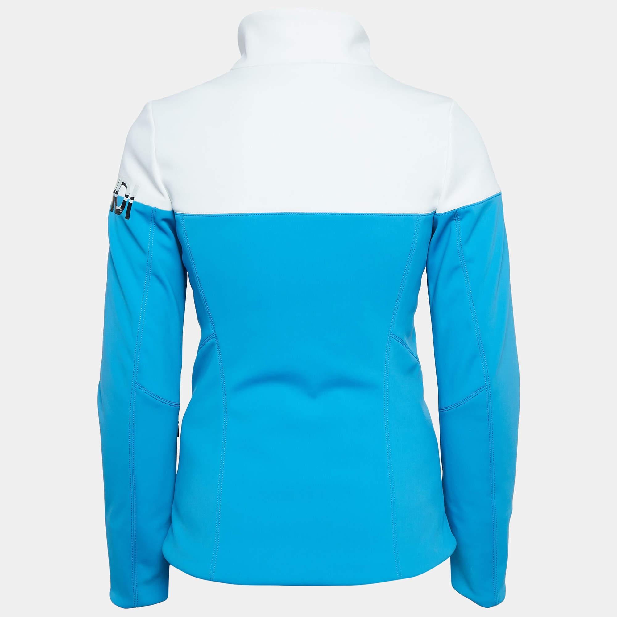 Stay stylish on the slopes with the Fendi Ski Jacket. This sleek high performance jacket features a striking blue and white color scheme providing both warmth and flexibility. Crafted from synthetic padding it offers superior insulation and comfort