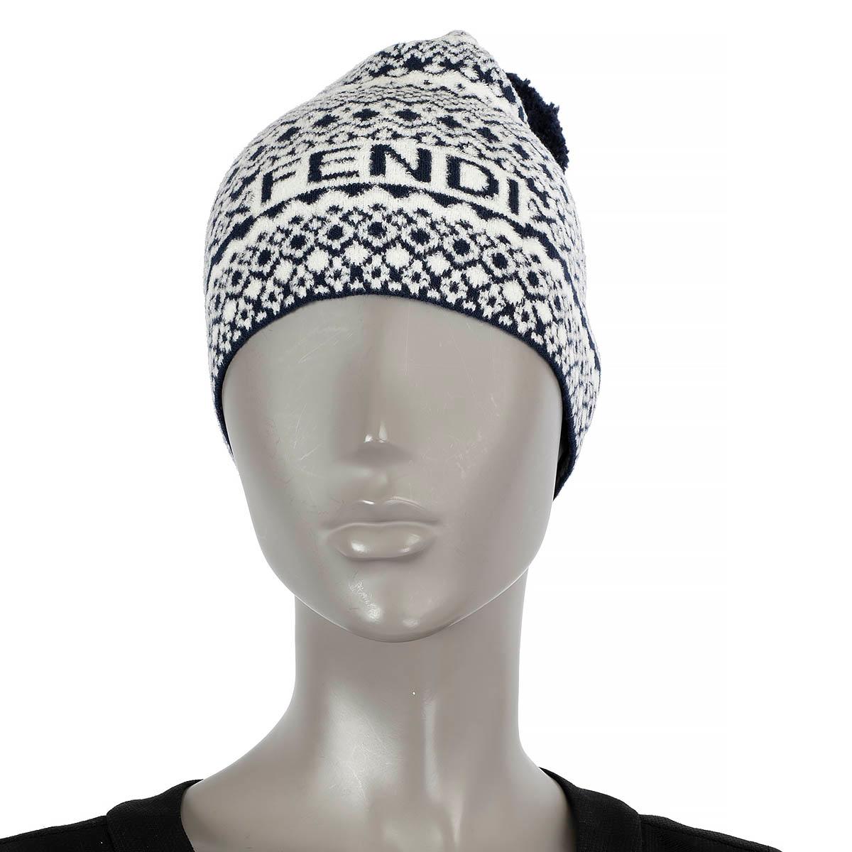 100% authentic Fendi Heritage beanie hat in navy blue and white wool (40%), viscose (31%), polyamide (28%) and elastane (1%). Decorated with geometric pattern, pompom and logo. Has been worn and is in excellent condition.