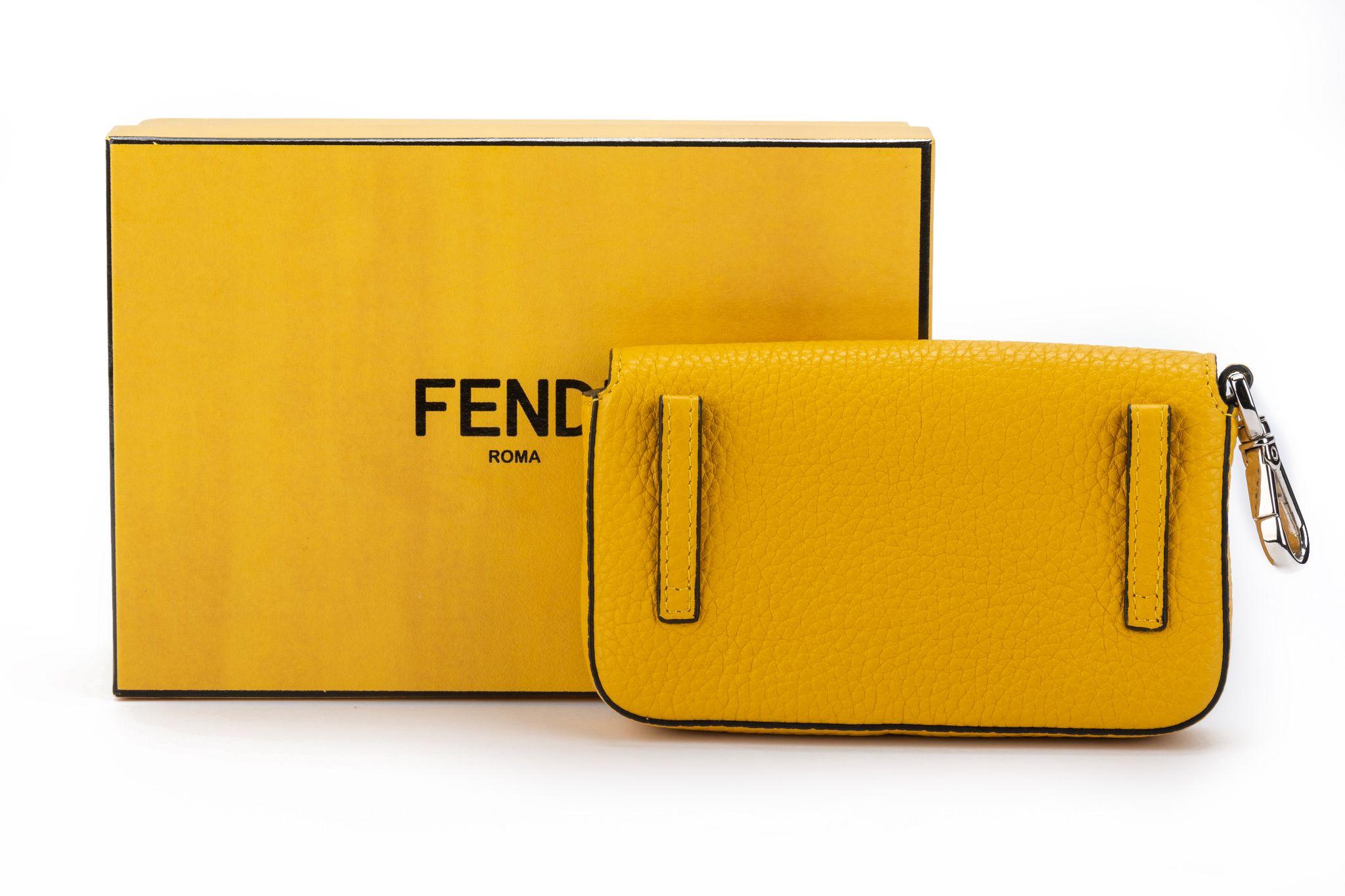 Fendi new yellow leather micro baguette with black interior and palladium hardware. Plastic still on hardware.
Box and original dustcover.