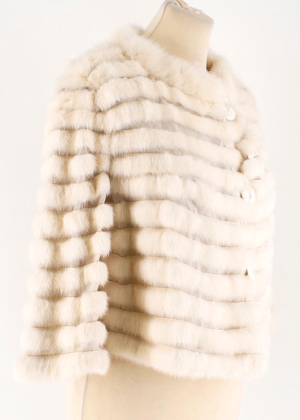 Short soft rabbit fur jacket from Fendi in a bone white colour. 

- Sheer panels
- Hologram label
- Front button fastening
- Mink fur 
- Made in Italy

Please note, these items are pre-owned and may show signs of being stored even when unworn and