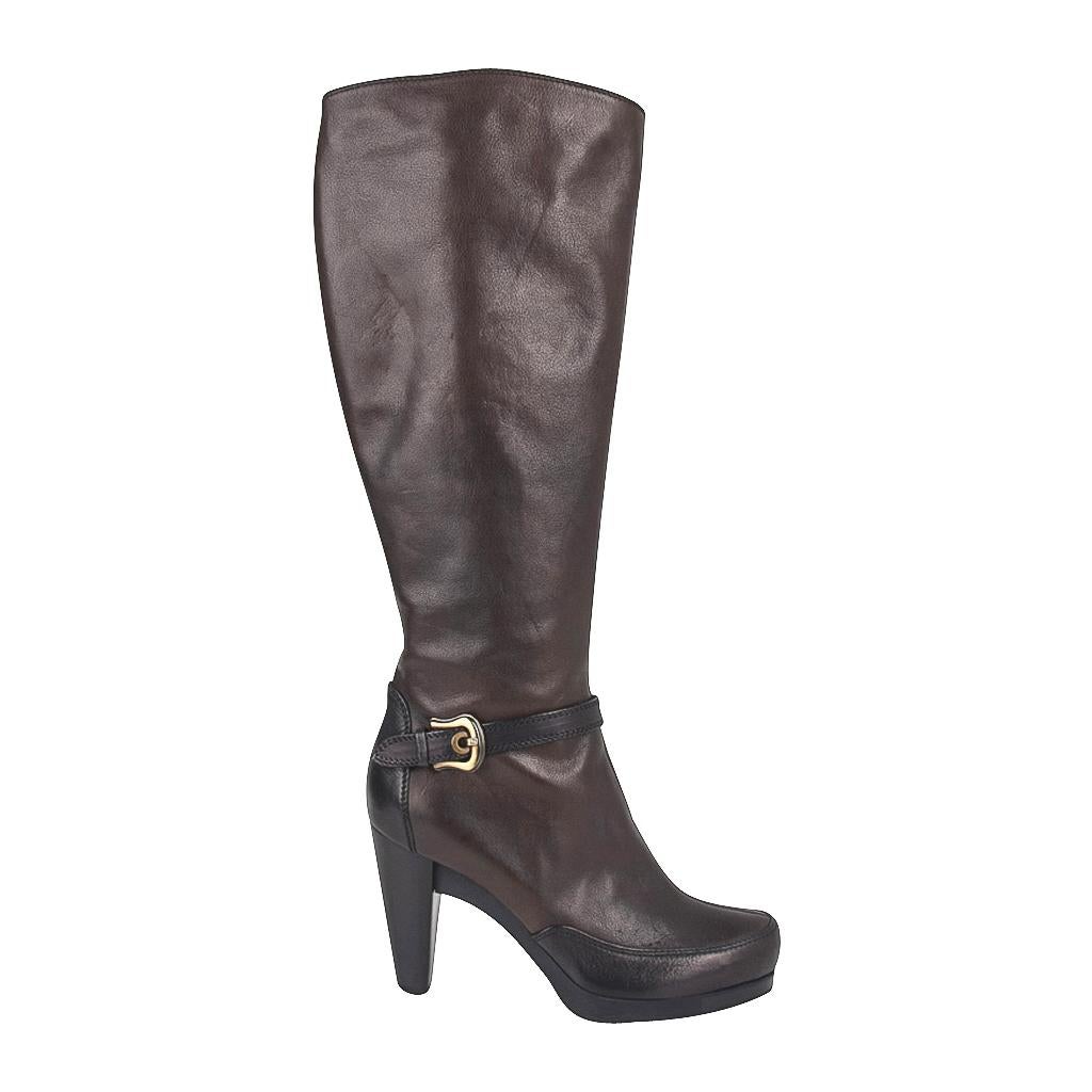 Guaranteed authentic Fendi brown knee high boots.
Equestrian inspired high heels.
Top stitch detail at toe and heel with a strap and buckle around ankle. 
1/2
