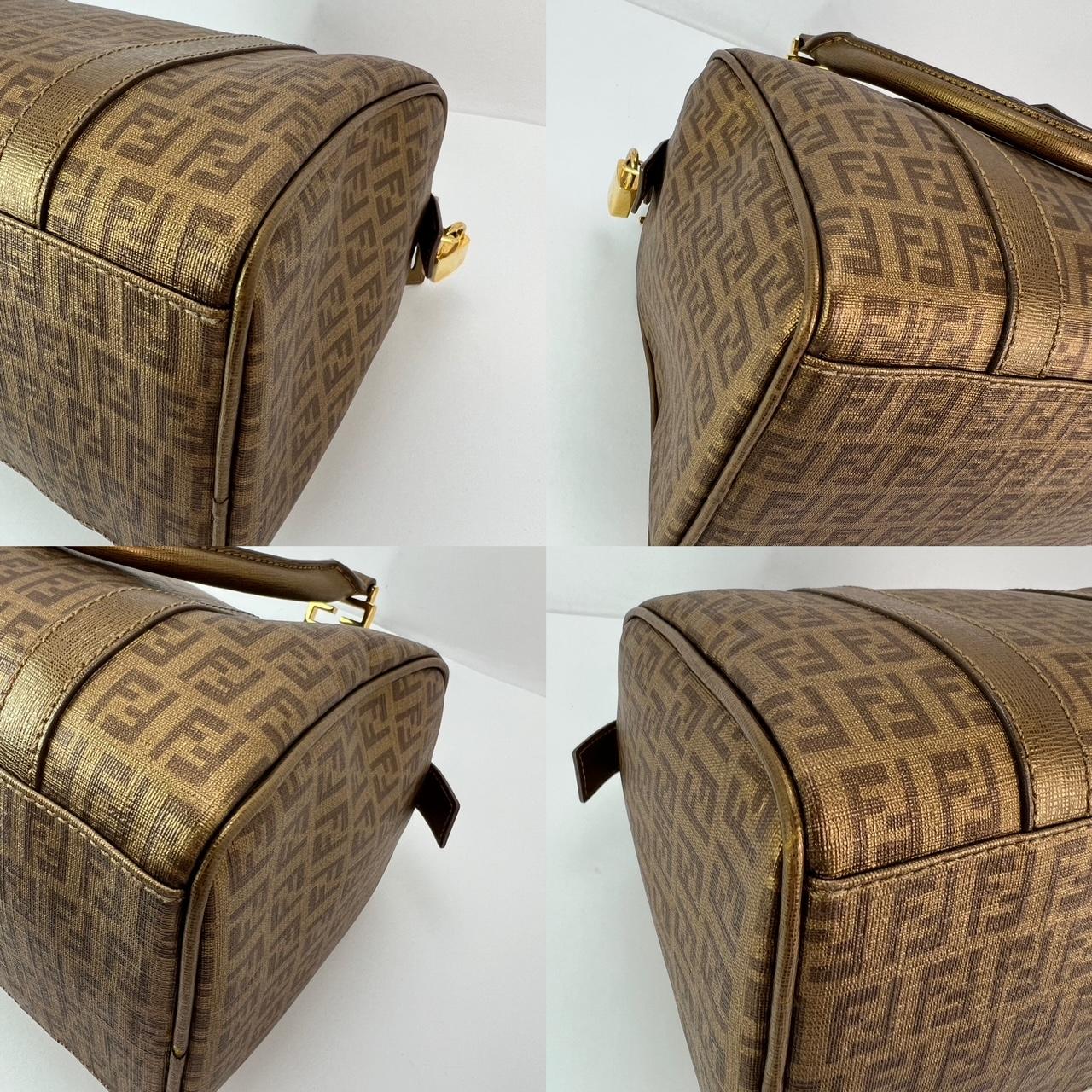 Pre-Owned  100% Authentic
Fendi Boston Gold Coated Canvas Hand Bag
RATING: B...Very Good, well maintained,
shows minor signs of wear
MATERIAL: coated canvas, leather trim
HANDLE: double coated leather, tiny rubbing on 1 
DROP: 6''
COLOR:  metallic