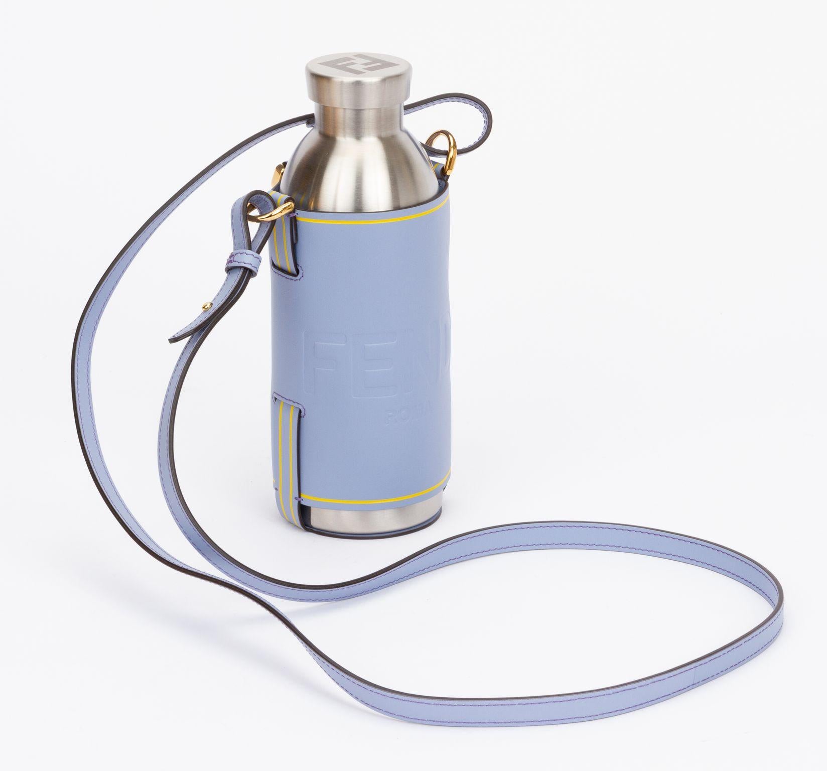 Fendi bottle holder made of calfskin leather in light blue. The piece comes with an adjustable and detachable shoulder strap (drop 21.5