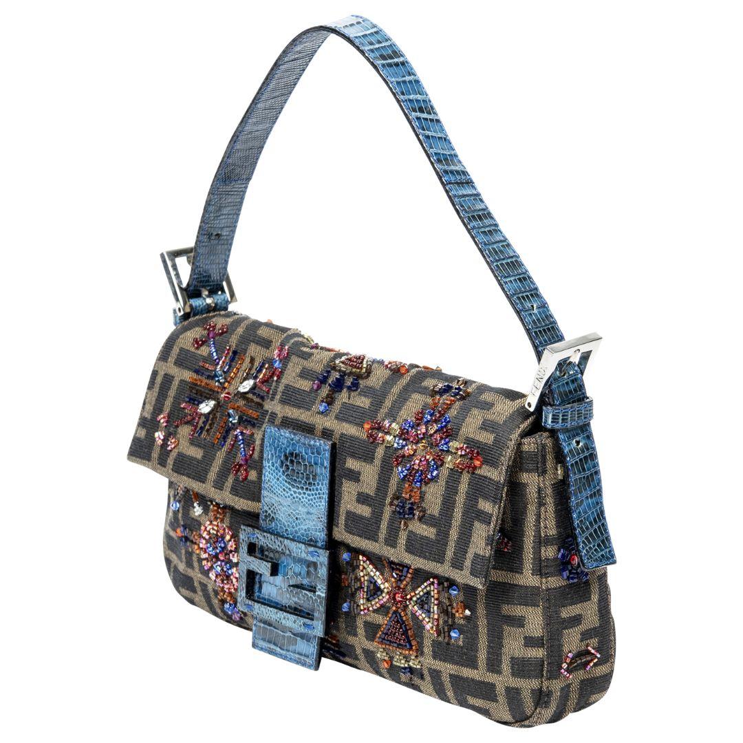 Fendi merges texture and color with this brown and blue Zucca patterned baguette, featuring python beading, delicate embroidery, and complementing silver-tone hardware.

SPECIFICS
Length: 10.0