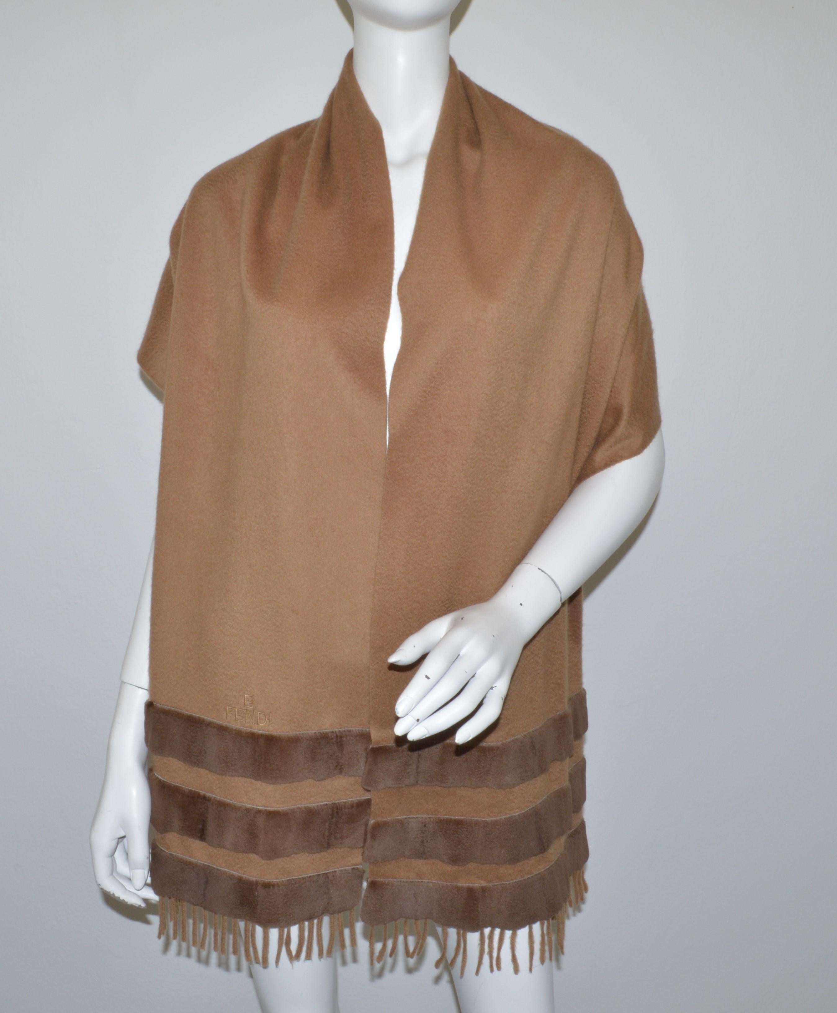 Fendi Brown Cashmere Shawl with Mink Fur Trim -- featured in a camel color with sheared mink stripes at the ends and a fringed trim. Made in Italy. Excellent pre-owned condition.

Measurements:
Length - 72”
Width - 17.5”