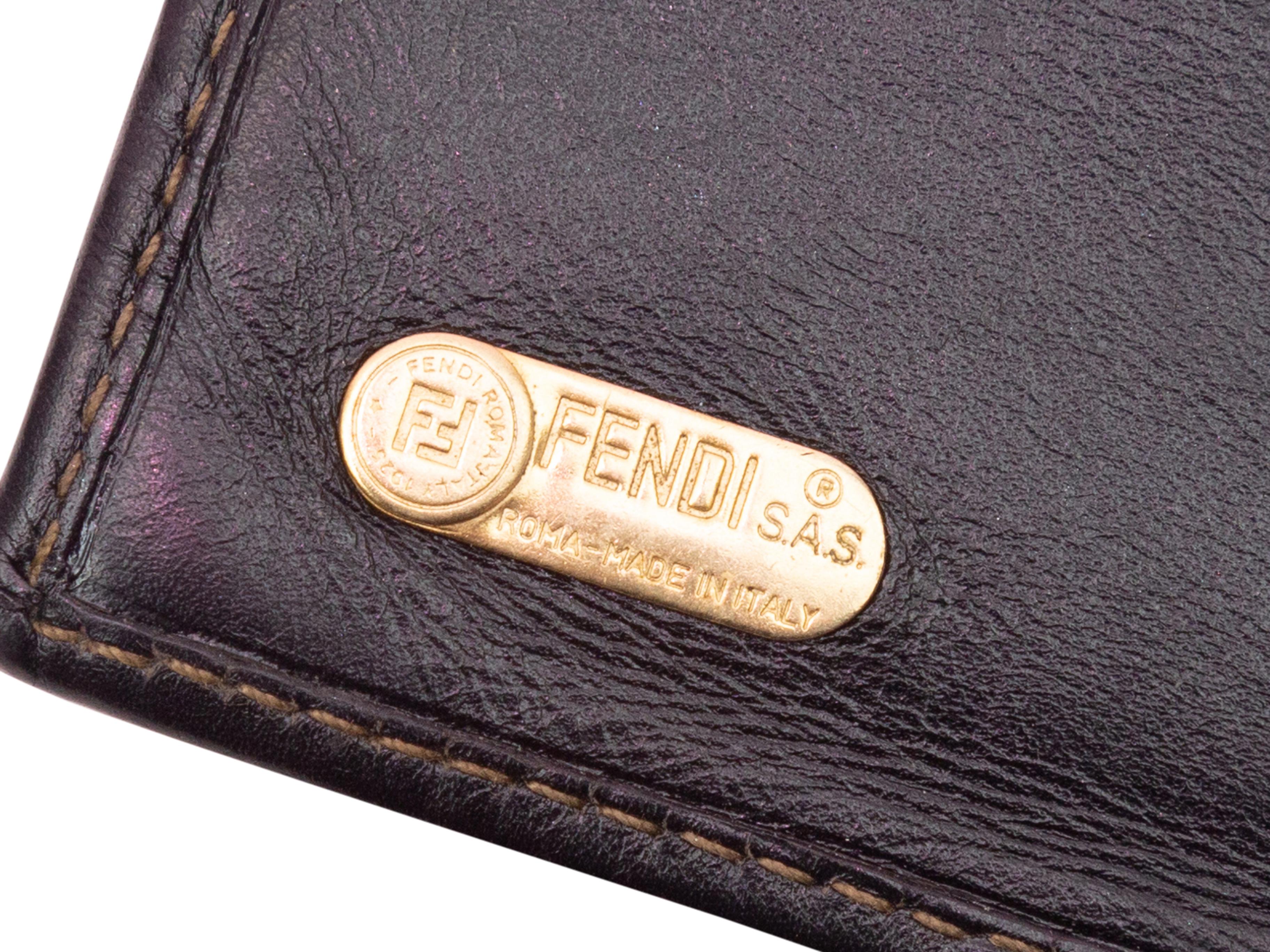 Product details: Vintage brown coated canvas and leather trim wallet by Fendi. Gold-tone hardware. Interior card and cash slots. Kiss-lock closure at top. 4