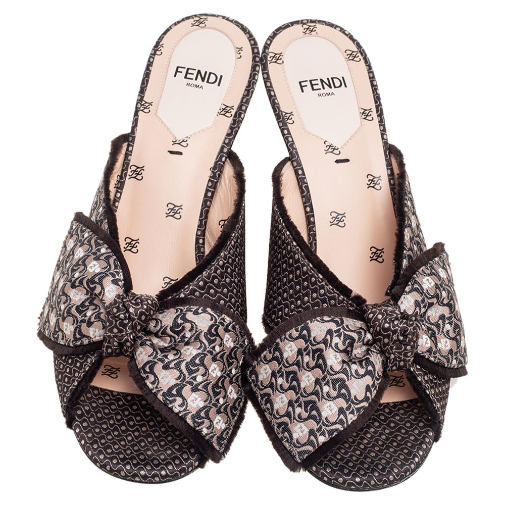 Fendi yet again brings a stunning set of sandals that's full of beauty and skillful craftsmanship. Crafted from fabric, they are designed with open toes and a knotted design. There are endless ways to style these beauties.

Includes: Original Box,